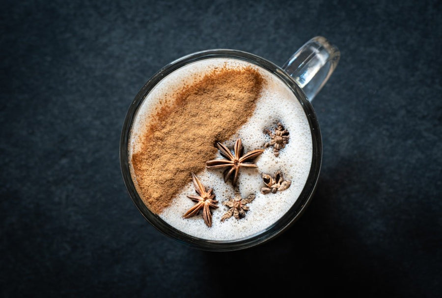 Two cups showcasing a Dirty Chai Latte and an espresso hybrid drink, highlighting rich textures and contrasting colors.