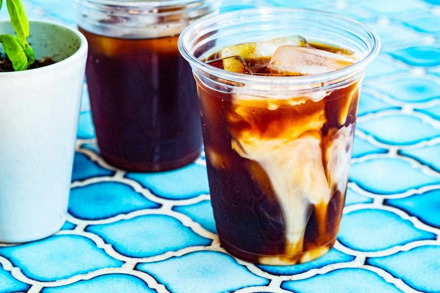 A side-by-side comparison of cold brew and iced coffee, highlighting their brewing methods, flavors, and serving styles.