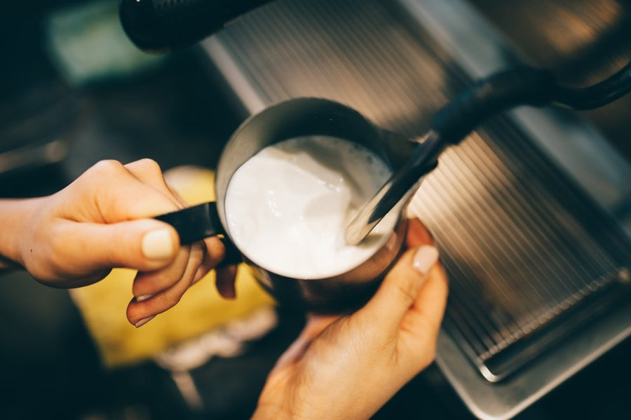 A refreshing Freddo Cappuccino served in a glass, showcasing rich espresso topped with frothy milk, perfect for hot Greek summers.