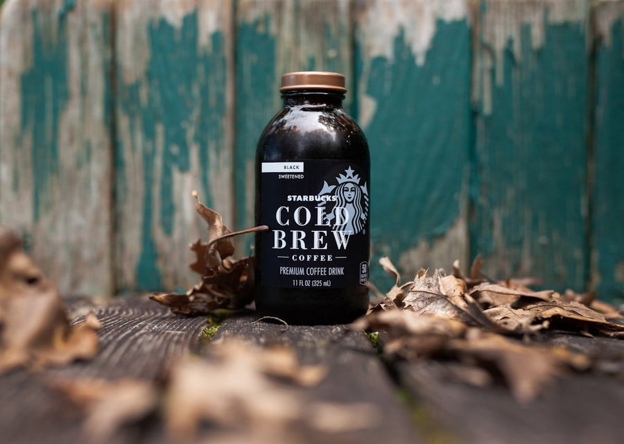 Step-by-step guide for making strong cold brew coffee, featuring coffee grounds, water, and brewing equipment.