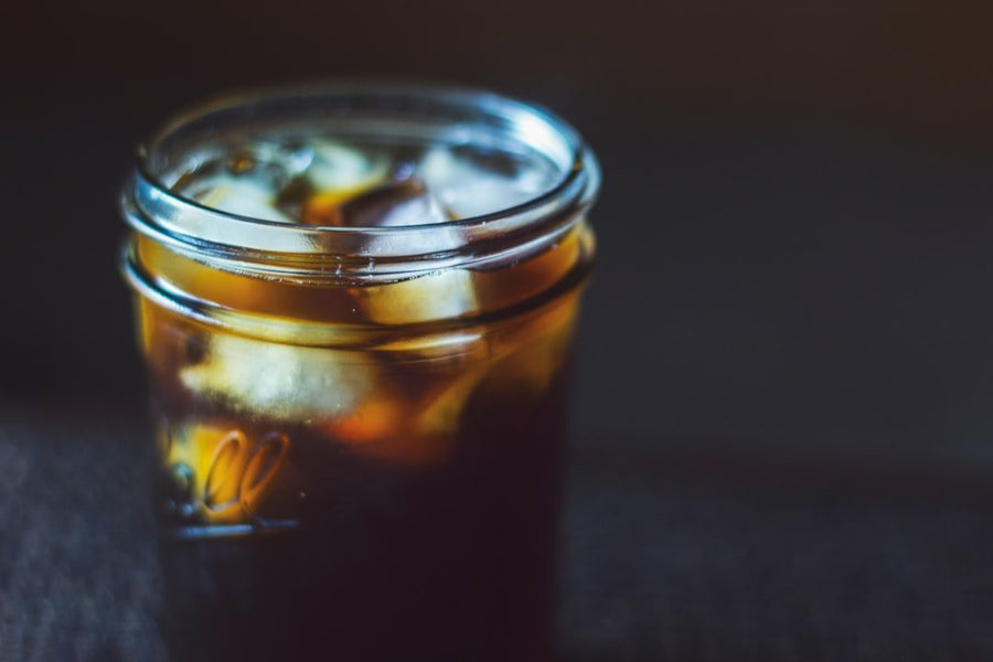 A side-by-side comparison of iced coffee and iced Americano, highlighting their environmental impact and sustainability factors.