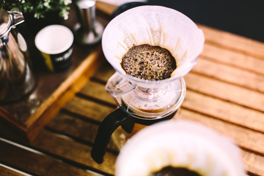 A selection of eco-friendly coffee makers showcasing sustainable materials and energy-efficient designs, emphasizing environmental impact and brewing quality.