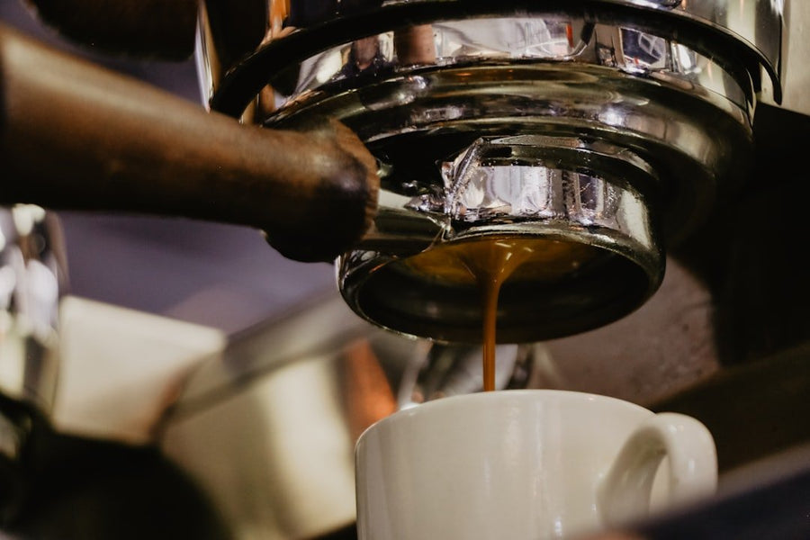 A refreshing Freddo Espresso served in a glass, showcasing Greece's popular iced coffee trend with rich crema on top.