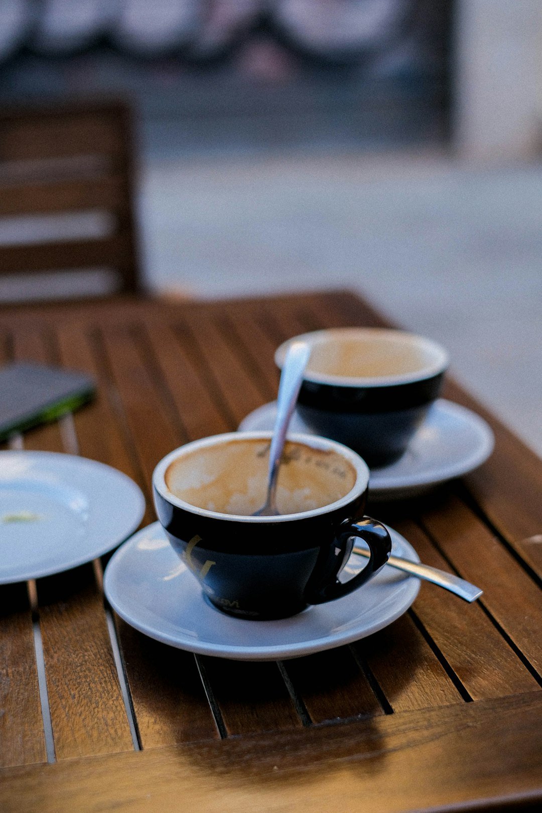 A glass of caffe freddo sits on a table, showcasing its rich espresso color and frothy top, highlighting Italy's coffee culture.