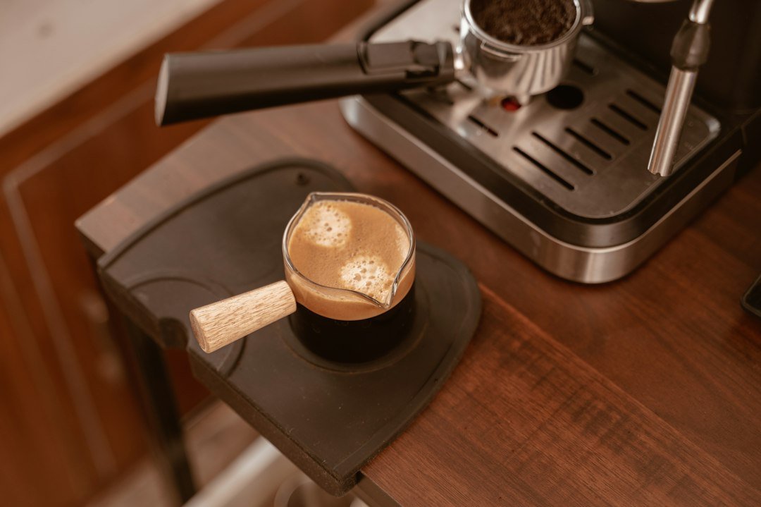 Iced Americano coffee in a clear glass, showcasing its rich color and refreshing appeal, highlighting its rising popularity among coffee chains.