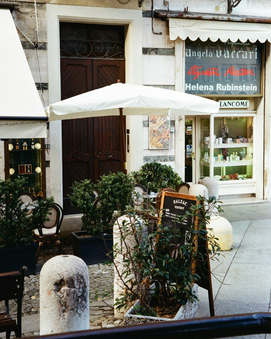 A bustling Italian bar scene with patrons enjoying counter coffee, showcasing vibrant social interactions and the unique café culture.