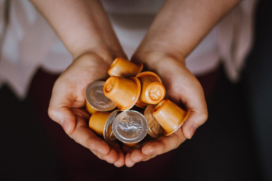 Comparison of compostable coffee pods and aluminum pods, highlighting environmental impacts and sustainability in coffee consumption.