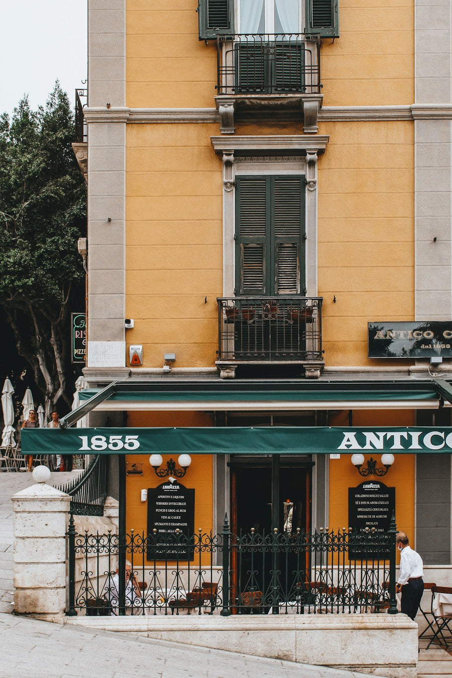 A bustling European café scene showcasing patrons enjoying coffee, engaging in conversation, and embracing the café culture.