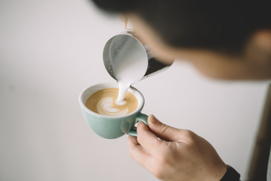 A creamy Spanish latte with rich espresso, milk, and a hint of sweetness, showcasing its inviting texture and flavor.