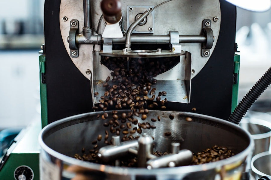 A close-up of a sleek, modern coffee machine blending seamlessly into a minimalist kitchen, illustrating the trend of invisible coffee technology.