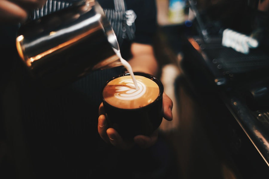 A refreshing Freddo Cappuccino served in a glass, showcasing its rich foam and iced coffee layers, highlighting Greek coffee culture.