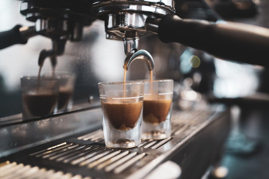 A refreshing glass of Freddo Coffee, showcasing Greece's popular iced espresso topped with frothy crema and served over ice.