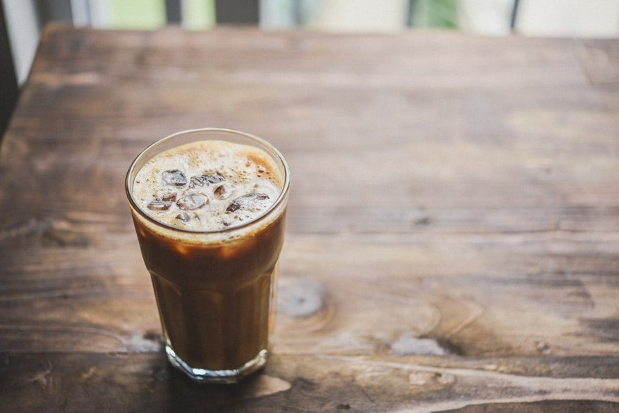 Side-by-side comparison of cold brew and Americano iced coffee, highlighting flavor, brewing methods, and serving styles.