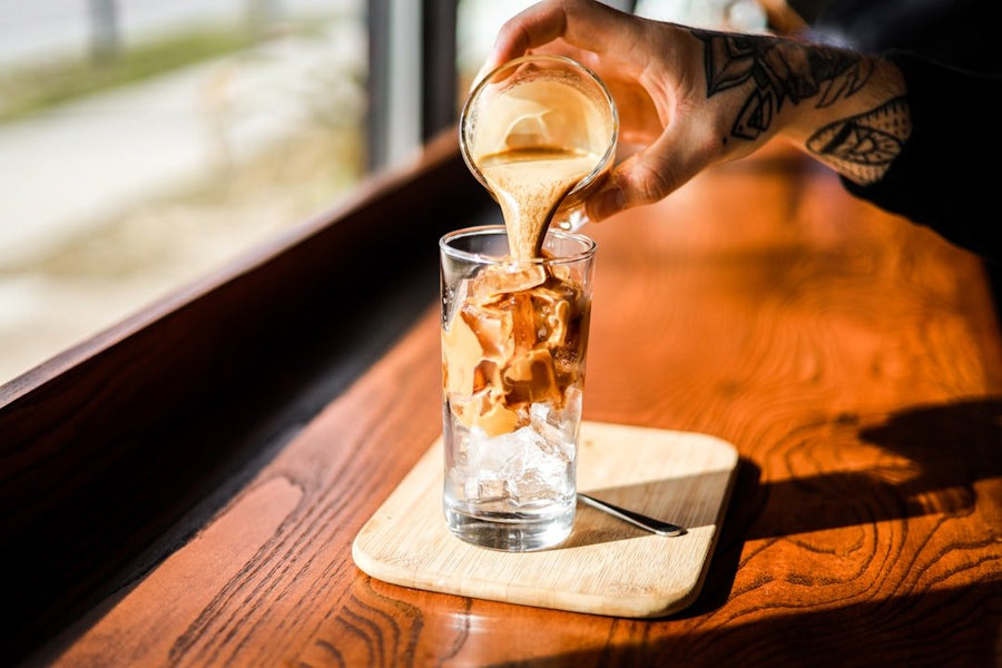 Side-by-side comparison of iced coffee and iced Americano, highlighting differences in preparation, flavor, and café preferences.