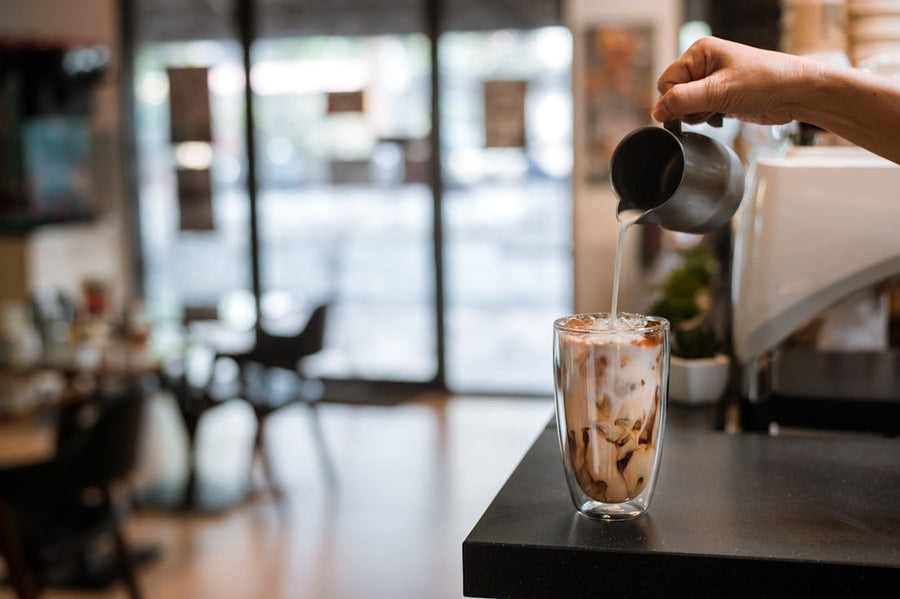 Two glasses side by side: one filled with iced coffee, the other with iced Americano, showcasing the taste test results.