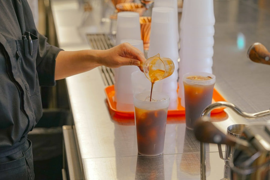 A side-by-side comparison of iced Americano and iced coffee, highlighting the differences in ice texture and beverage color.