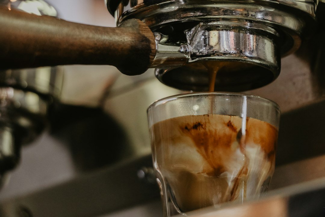 A close-up of a caffe americano in a ceramic cup, showcasing its rich, dark color and smooth surface, highlighting its complexity.