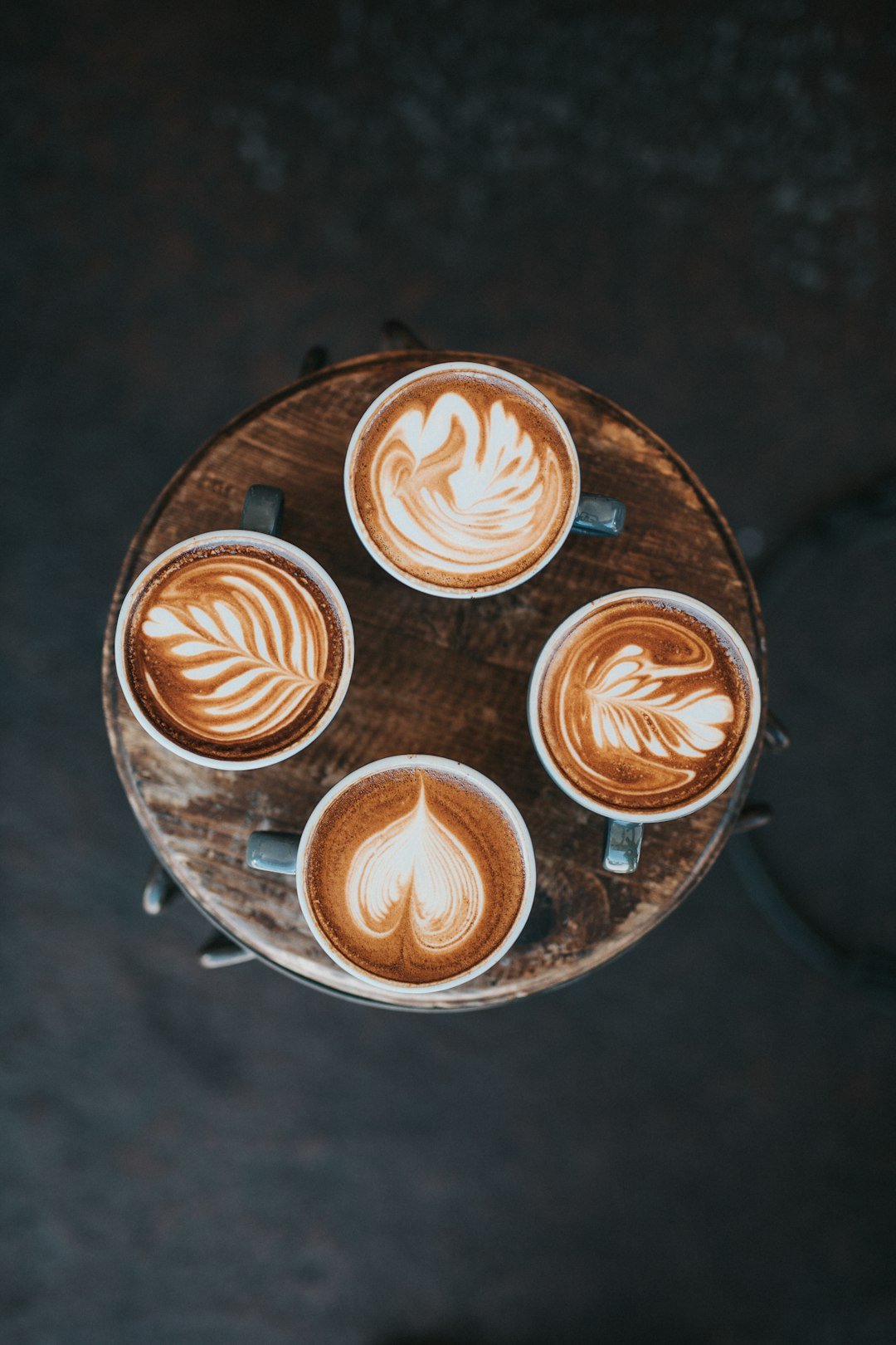 A barista expertly pours a rich, dark espresso shot into a small cup, highlighting the essence of espresso culture.