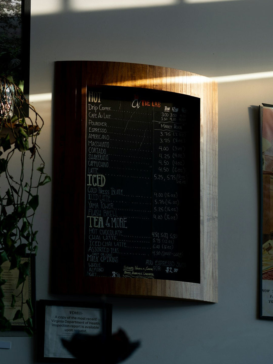 A barista prepares a latte using oat milk, highlighting its growing popularity in cafés as a dairy alternative.